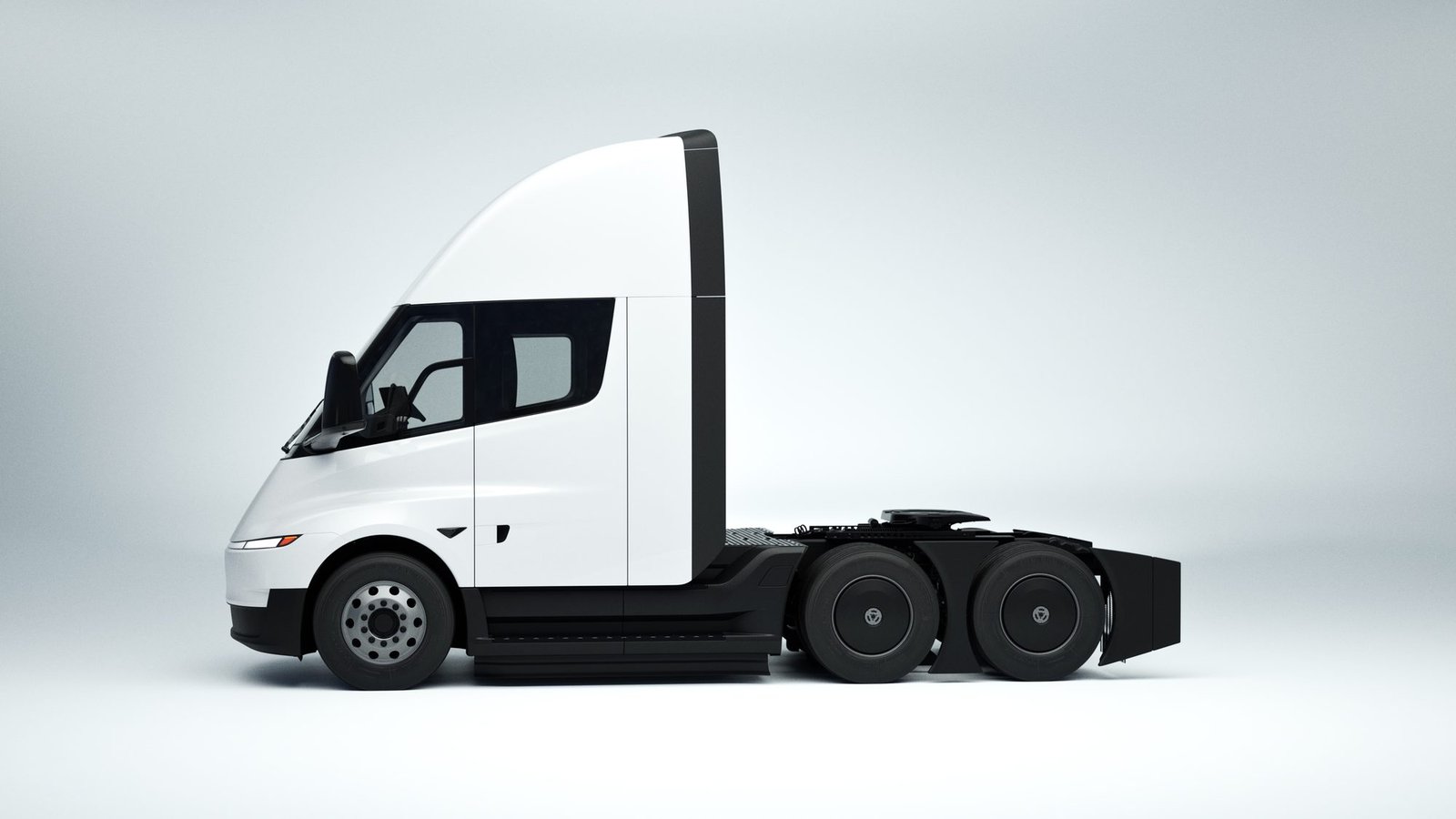 Tesla Semi iluminado en un estudio oscuro